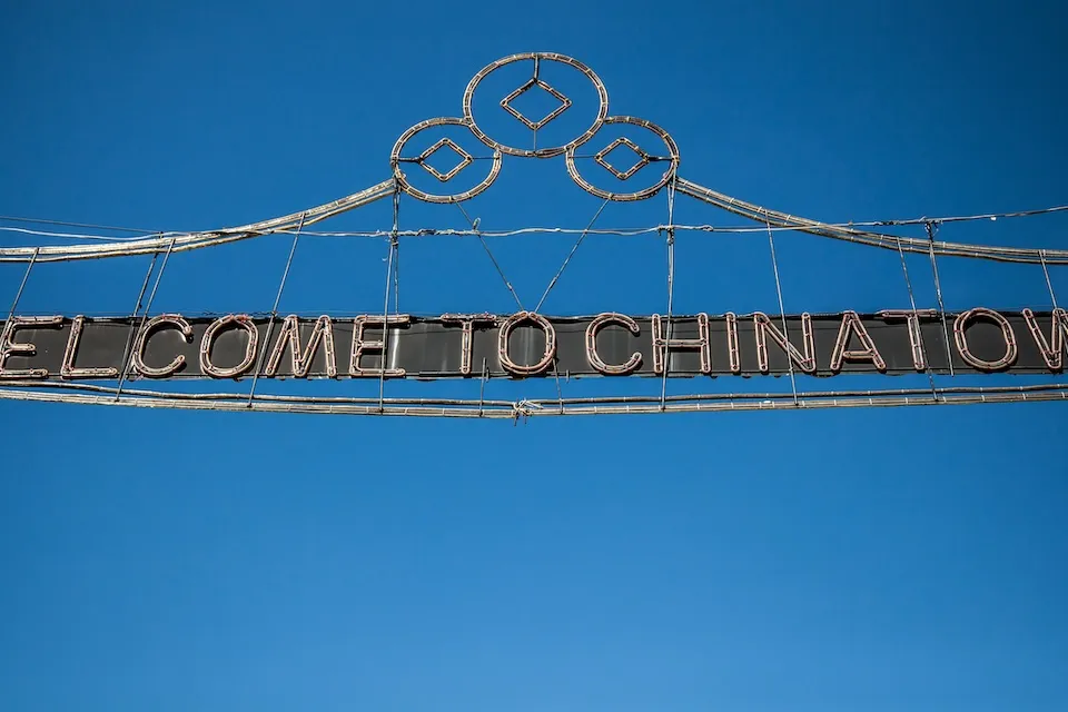 Wire sign over street "Welcome to Chinatown" in New York City.